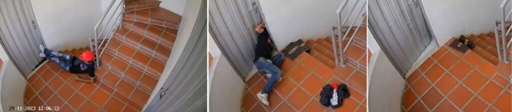 Ladrón forzando una puerta con los pies es grabado por camara ubicada en el descanzo de un edificio donde se encuentran las puertas de los apartamentos